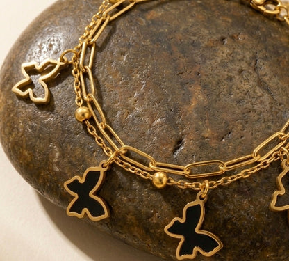 Whimsical Butterfly Layered Charm Bracelet – 18k Gold & Black Enamel