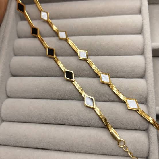 Anti-Tarnish Waterproof Diamond Link Bracelet - Gold Geometric Chain Bracelet displayed on a jewelry organizer.